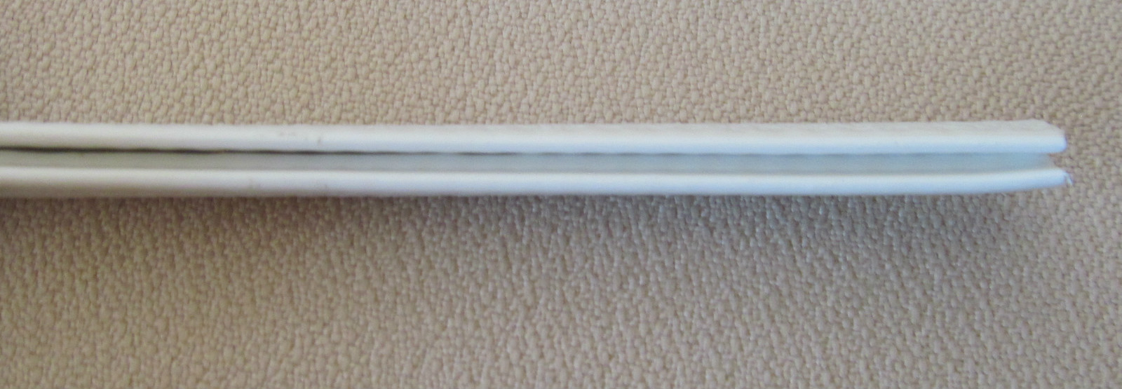 Sample Piece 1/16″ x 9/16″ WHITE Edge Trim Vinyl PVC Seal Lock Permanent Grip