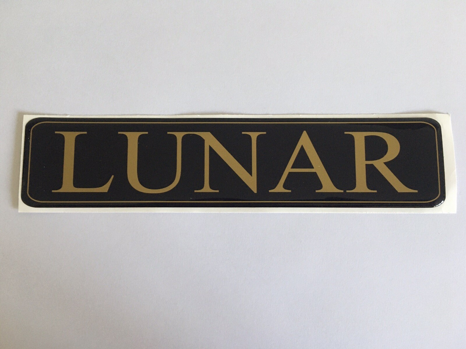 LUNAR CARAVAN MOTORHOME RECTANGLE FRONT BADGE DOMED RESIN BLUE & GOLD HIDE DENTS